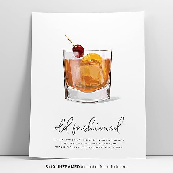 An Old Fashioned Cocktail Wall Art print is standing against the wall.