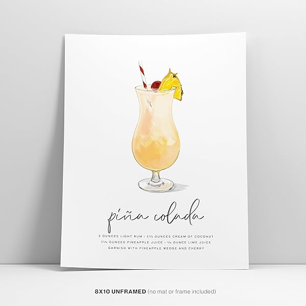 Pina Colada Cocktail Wall Art poster is leaning against a white wall.