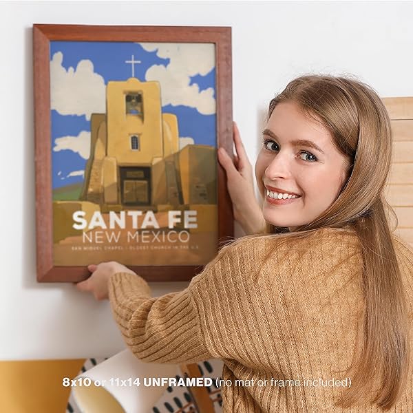 Woman hanging San Miguel Chapel Santa Fe, NM vintage poster-framed (frame not included)